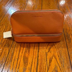Brown Maurice’s cosmetic bag